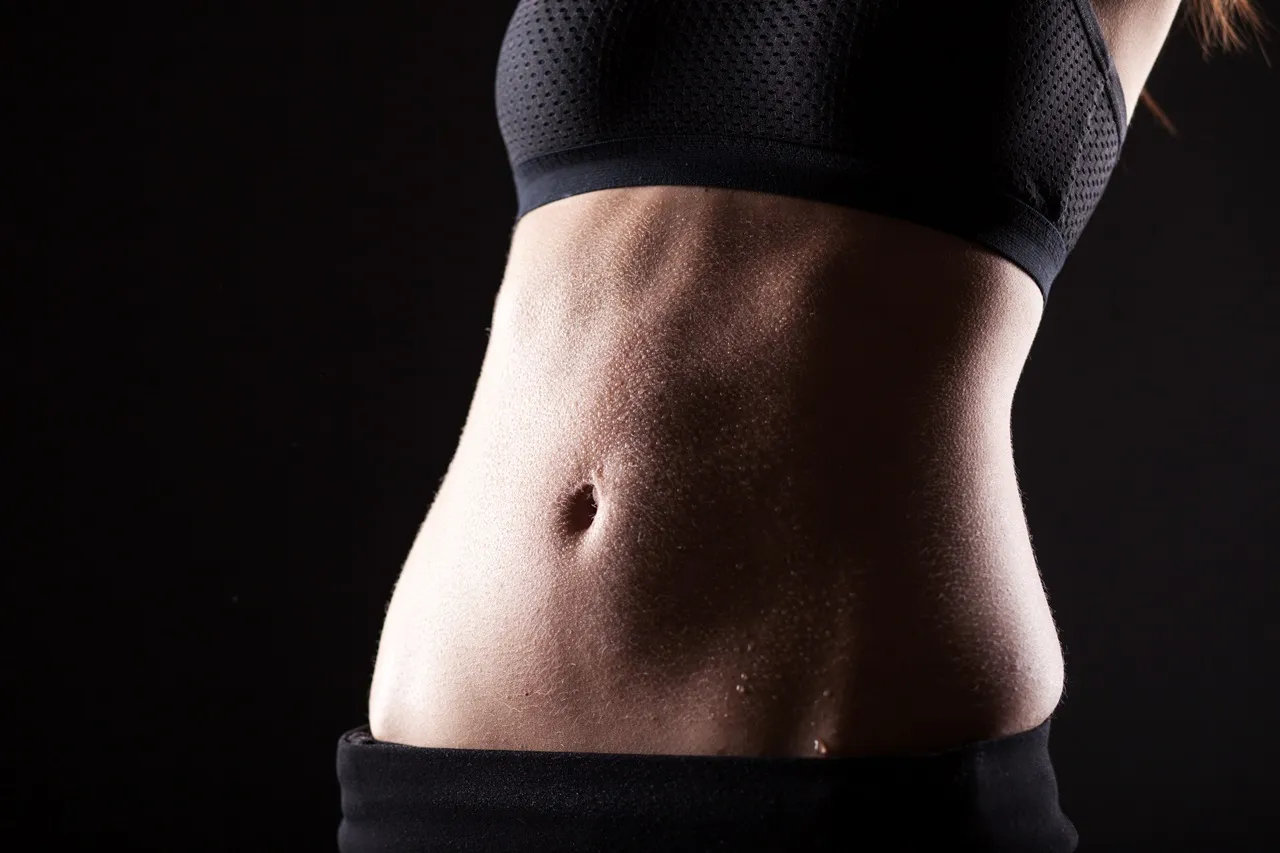 close up of woman with sweat in belly