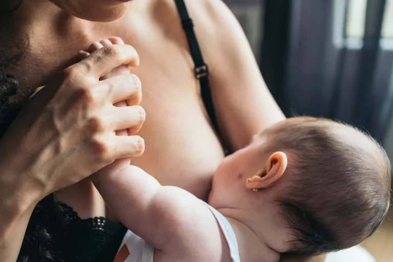 mother breastfeeds her baby