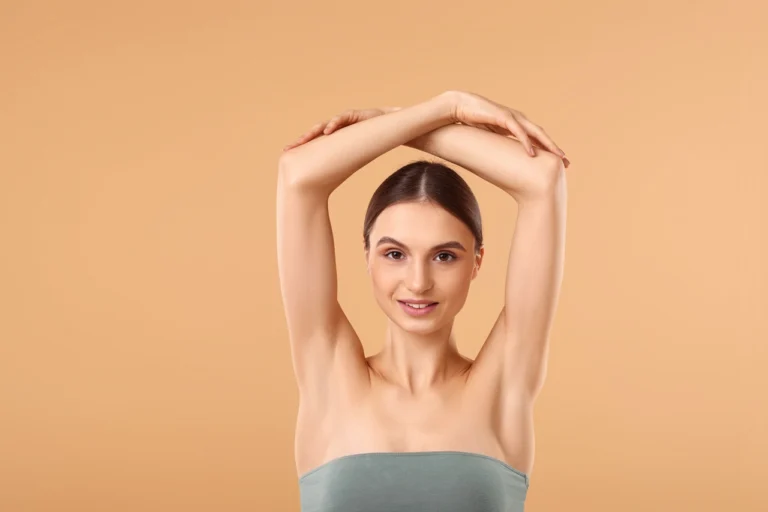 woman raising both arms