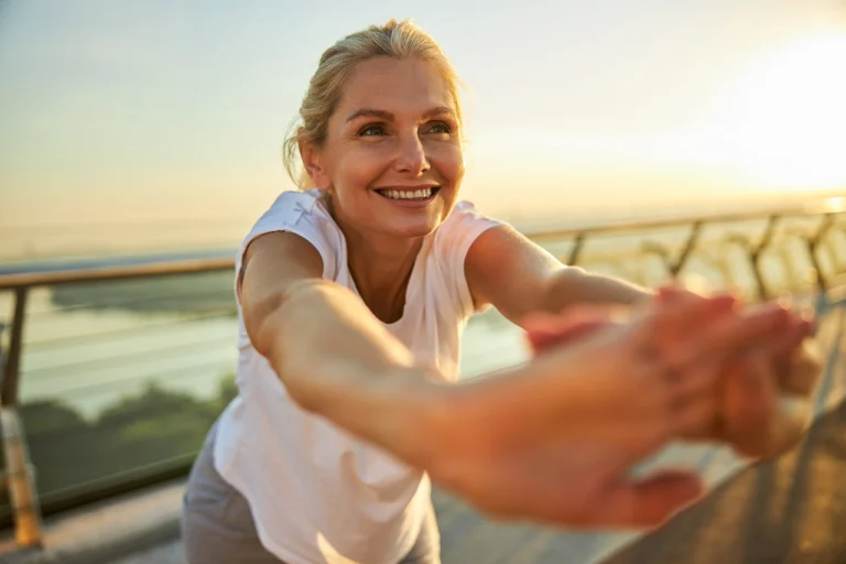 mature blonde woman exercising outside