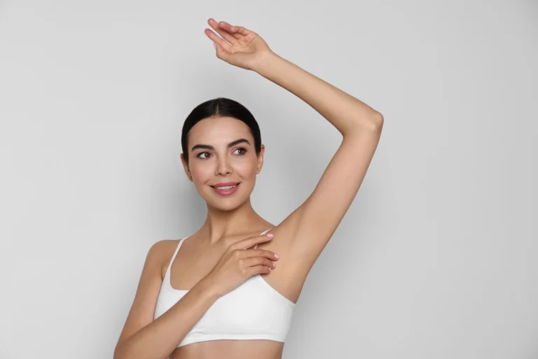 smiling woman arms raised