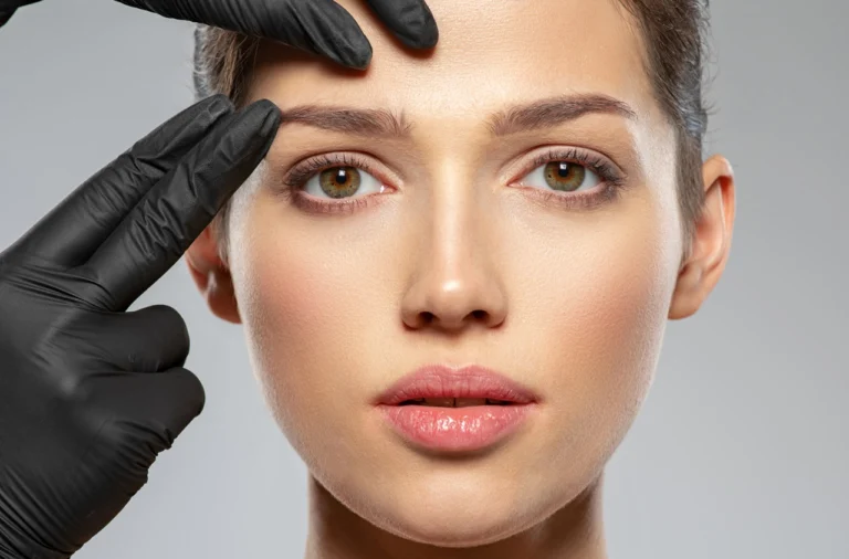 woman receiving brow treatment