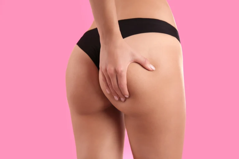 slim woman in underwear on pink background