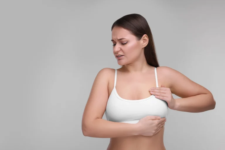 woman feeling pain in her chest